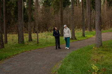 Obraz premium Cancer survivor walking along park trail, concept of physical activity, self-care, and motivation during recovery.