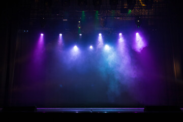 scene, stage light with colored spotlights and smoke