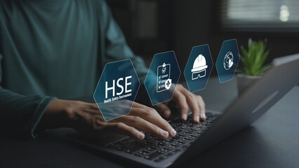 Obraz premium Digital HSE system with safety, health and environment icons on virtual interface. Business professional managing workplace safety, regulations and environmental standards online.