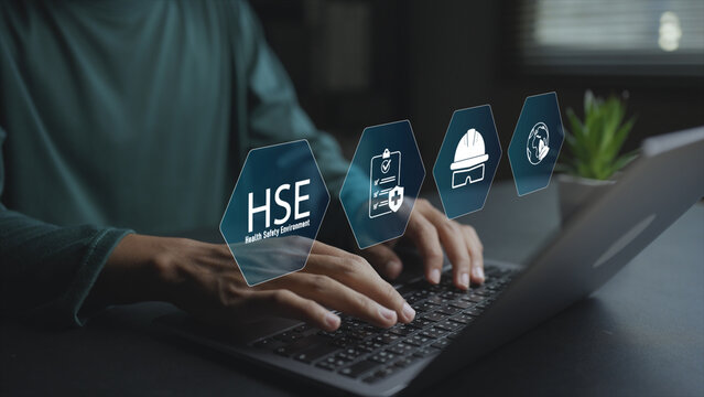 Digital HSE system with safety, health and environment icons on virtual interface. Business professional managing workplace safety, regulations and environmental standards online.