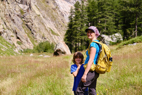 Portrait of a mother with her son on a mountain path, Veny valley