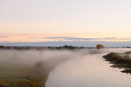 Fog in the early morning. Dawn by the river.