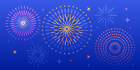 Vibrant fireworks and stars exploding in a dark blue night sky