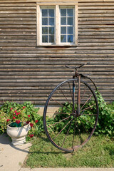 Fototapeta premium Rustic Vintage Bicycle Display Against Weathered Wooden Wall