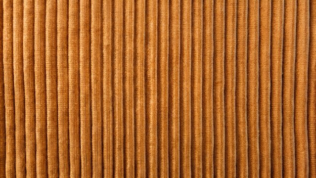 Close Up Of Golden Brown Corduroy Fabric Texture Background With Vertical Ribs