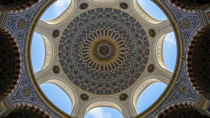 Fototapeta premium Intricate islamic architecture, detailed mosque dome from below, traditional geometric patterns and golden embellishments