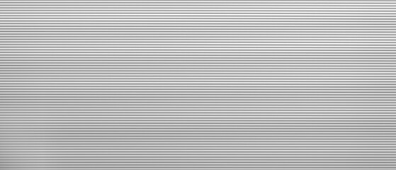 Obraz premium White background with a lot of horizontal lines. The lines are very thin and spaced out. The background is very simple and clean