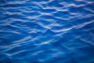 Obraz premium blue water background. Deep and dark turbulent sea or ocean water