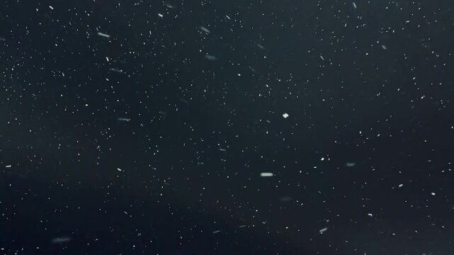 Closeup Snowflakes Against Bright Light Source At Night, Detailed Crystalline Flakes And Soft Bokeh Creating Delicate Patterns And Shimmering Halos, Ethereal Cold Atmosphere With Subtle.