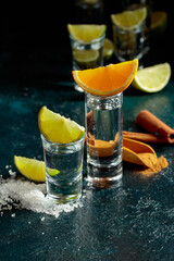 Tequila shots on a black background. © Igor Normann
