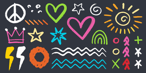 Colorful chalk drawings and symbols on a dark blue chalkboard © Juel