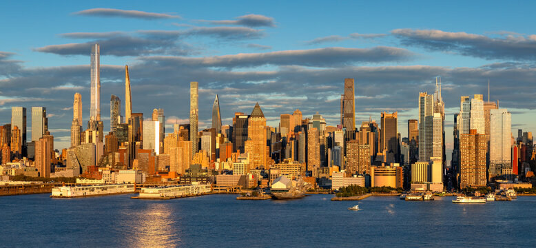 Elevated view of the Midtown Manhattan skyline along the Hudson River waterfront. Skyscrapers and supertall towers in New York City