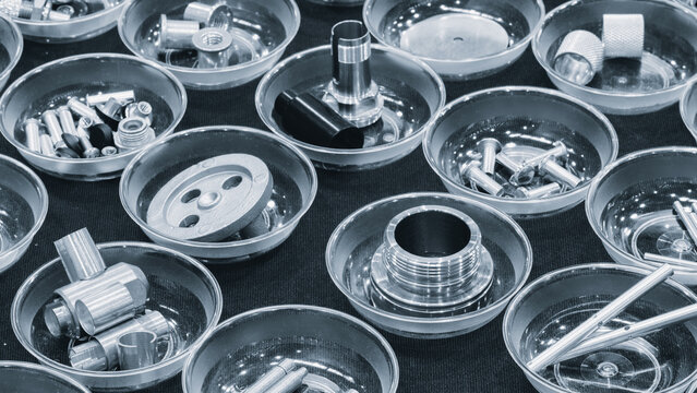 Various bolts, screws, nuts, bushings and other metal fasteners