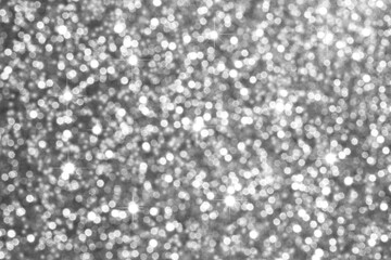 Shimmering silver glitter background with bokeh lights for festive, luxurious design projects