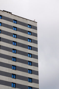 City building with sleek design, Skyscraper featuring blue windows and structured facade