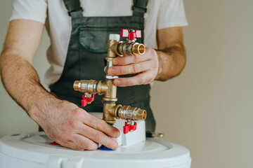 Installation of plumbing fittings on water heater by master