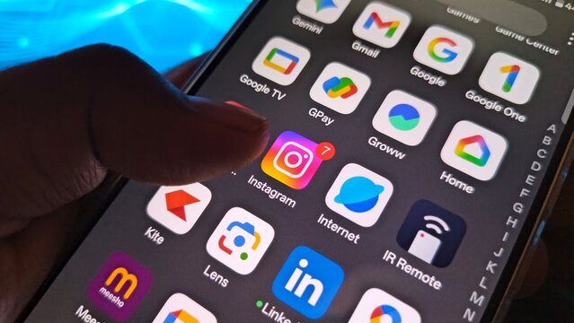 Closeup of smartphone screen showing instagram and other app icons