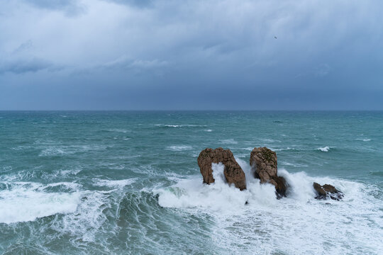 Storm and waves at "Urro del Manzano," also known as "Gateway to the Cantabrian Sea." Cantabrian Sea. Liencres Natural Park in the Costa Quebrada Geopark. Liencres, Cantabria, Spain, Europe