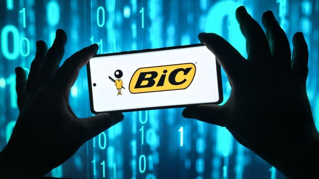 Bic logo on a smartphone screen with binary code background