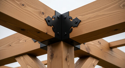 Close-up view of a modern wooden pergola with exposed beams and black metal bracket against a clear sky, highlighting design and construction details