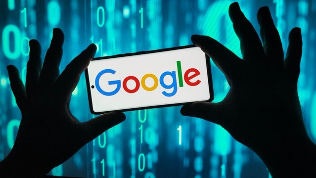 Hands holding a smartphone with google logo