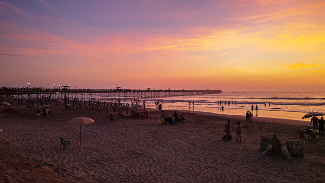 Panoramic aerial drone photo of a beautiful sunset over Pimentel, Chiclayo, northern Peru, a coastal tourism destination for travel and summer vacations