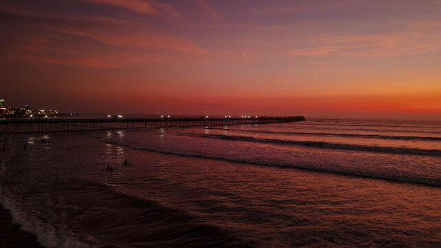 Panoramic aerial drone photo of a beautiful sunset over Pimentel, Chiclayo, northern Peru, a coastal tourism destination for travel and summer vacations
