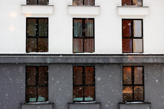 Cozy winter building scene, Serene apartment front illuminated by winter snow and soft light