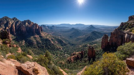 Vast elevated panorama captures rugged rock formations under brilliant sunshine
