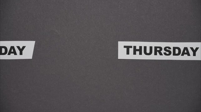 Concept of fast passage of time from Monday to Sunday. Stop motion