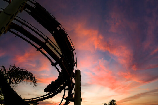 Sunset Silhouette: Roller Coaster Over California Coast