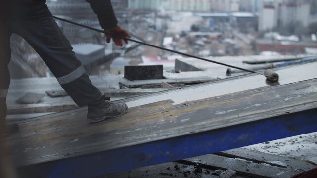 Lubricating concrete formwork before pouring on construction site