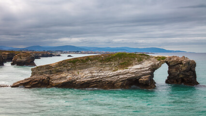 Fototapeta premium Majestic natural rock arches at Cathedrals Beach (Praia das Catedrais) in Ribadeo, Galicia, Spain.