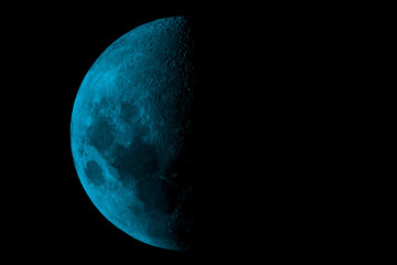 Naklejka premium Surreal Cyan Blue Last Quarter Moon with Detailed Craters Isolated on Black