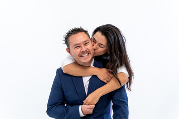 Fototapeta premium Happy couple embracing, woman kissing man's cheek