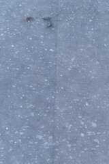 Fototapeta premium A crack in the ice with bubbles on a pond.