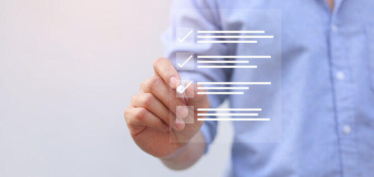 close up businessman manager hand use stylus pen to checkmark on virtual  survey report online checklist task to estimate and share opinion for business survey and checklist satisfaction concept