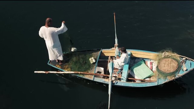 Authentic Egyptian Fisherman on Traditional Wooden Boat in the Nile River&mdash;Cairo, Egypt (Aerial View)