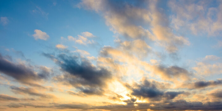 blue sky background with clouds. nature in summer at sunrise. dynamic cloudscape above horizon in morning light. nice image for beautiful outdoor wallpaper