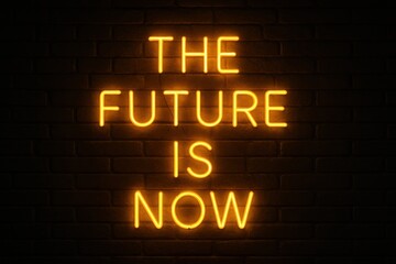Fototapeta premium Inspirational neon sign displaying the future is now in an urban modern nighttime motivational concept