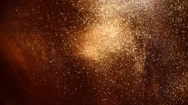 Gold particles floating background, Liquid gold, golden abstract backdrop. Golden abstract backdrop. Beautiful metallic yellow texture, Metallic paint close-up. Art Wallpaper waves surface. 