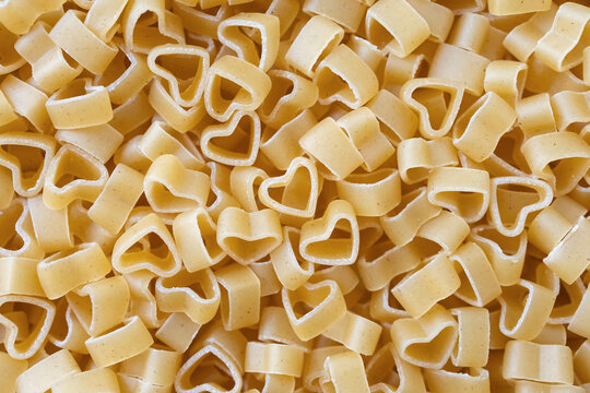 Сlose-up of heart-shaped pasta. Food concept. Selective focus, top view