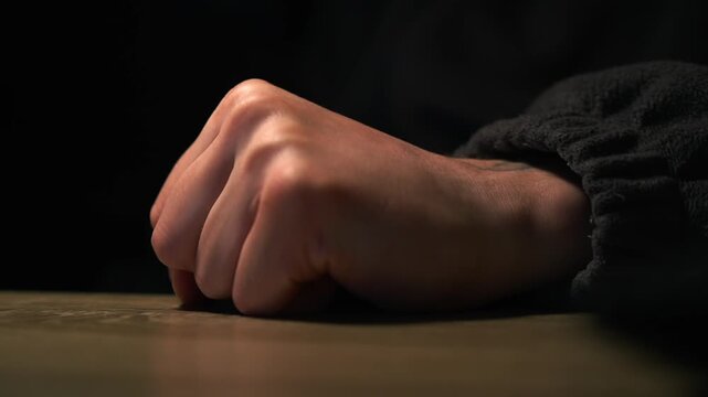 Aggressive behavior of a man.
A man slams his fist on the table in anger.
Domestic violence.
Conflict situation