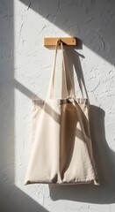 Hanging Organic Cotton Tote Bag Mockup on Plaster Wall