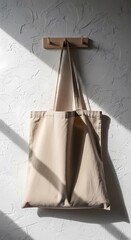 Hanging Organic Cotton Tote Bag Mockup on Plaster Wall