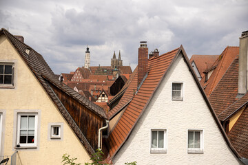 Panoramic view over Rothenburg ob der Tauber old town from the medieval city wall in Bavaria, Germany, showing historic rooftops, towers, and scenic fortified architecture.