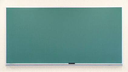 old school green chalkboard with eraser on the wall © nd700