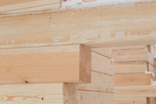 Construction of a wooden house from timber with trim.