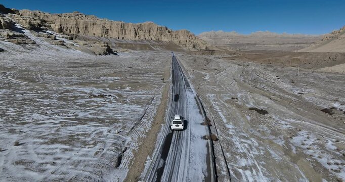 White offroad car running in zanda Tulin National Geological Park in tibet, China