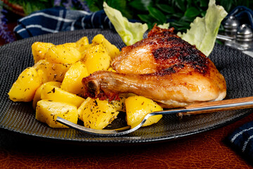 Appetizing baked chicken leg quarter.